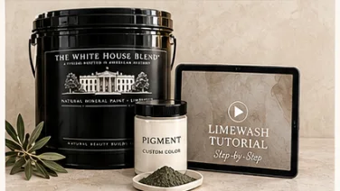 A pail of The White House Blend limewash, a tin of custom pigment, and the step-by-step tutorial course on a tablet